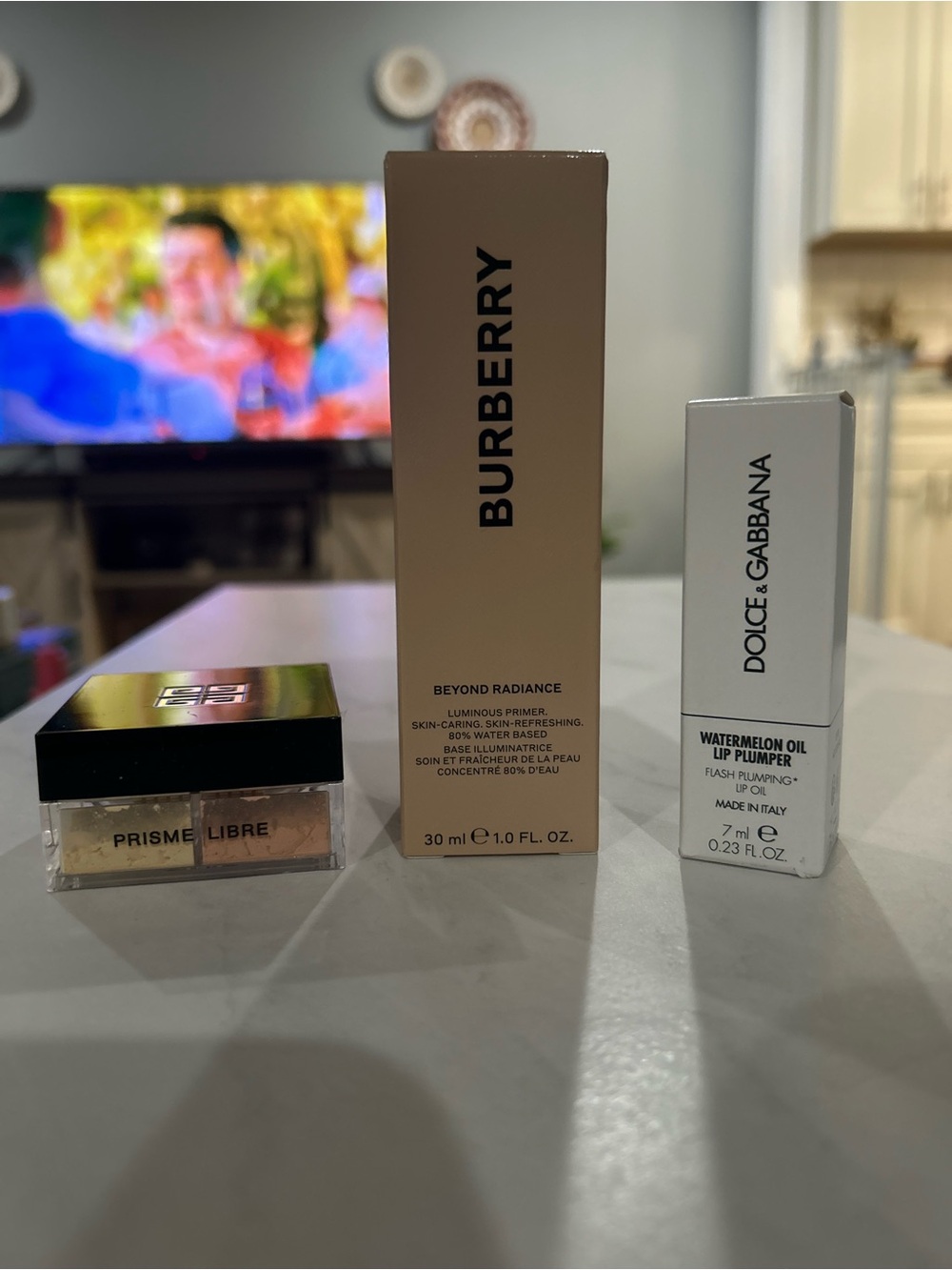 Givenchy Powder, Burberry Primer, Dolce & Gabbana Lip Plumper